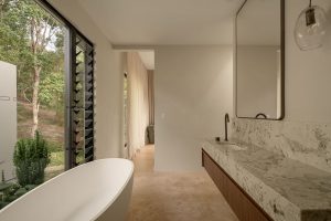 Alpinus granite vanity in main bathroom with large windows overlooking Tallebudgera Valley